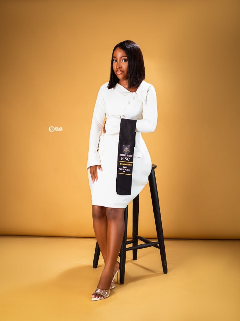 Statistics graduate in white dress